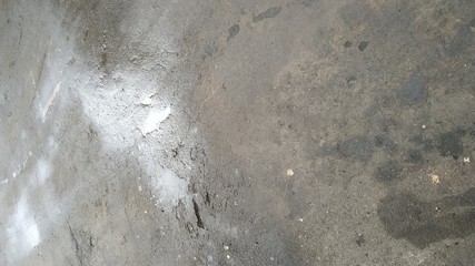 puddle and oil stains on dark asphalt