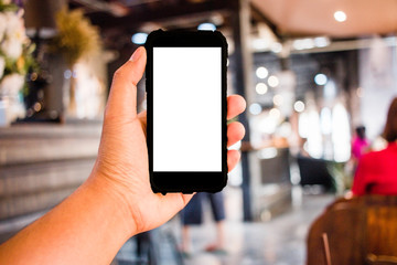 Close up of Hand man holding smart phone in office blurred background