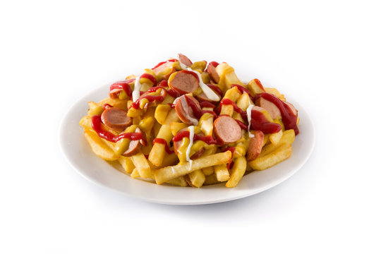Typical Latin America Salchipapa. Sausages with fries, ketchup, mustard and mayo, isolated on white background