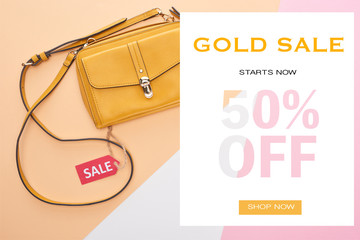 top view of bag with sale label on beige, white and pink background with gold sale 50 percent off...