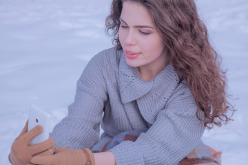 Winter selphie. Portrait of young beautiful woman  make photoshut herself.