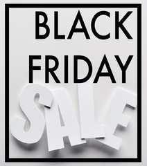 top view of black friday sale lettering on white background
