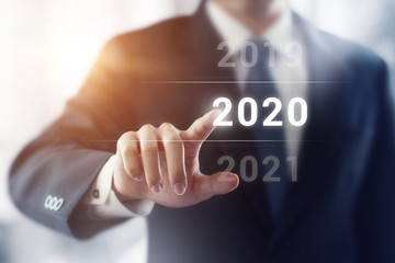 Businessman pointing year 2020. Business new year concept.