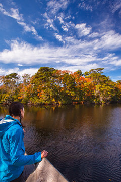 Bekah Herndon looks out from a viewpoint at the large freshwater pond along the ADA Trail  in the Nags Head Woods Preserve.