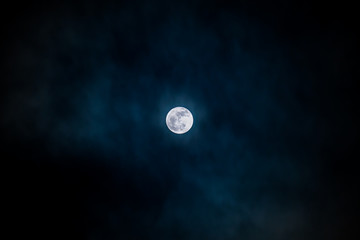 Full moon black background with clouds detail surface