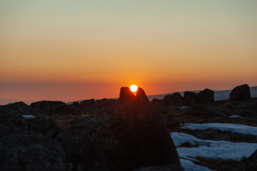 rocks with sun at the sunset