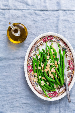 green beans with almonds and bottl eof oil