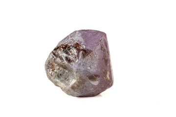 macro mineral stone alexandrite red - violet in daylight on a white
