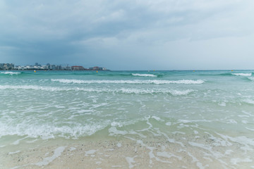 Dramatic Cloudy Sky for Thunderstorm, Sea waves at the beach in Arabian Sea.