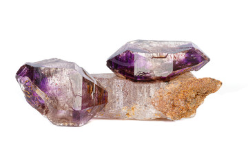 macro mineral stone Amethyst on smoky quartz on a white background