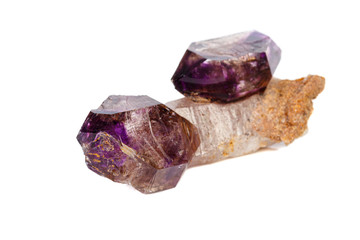 macro mineral stone Amethyst on smoky quartz on a white background