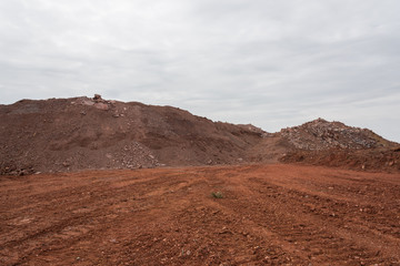 Earthwork gravel space background view stacked into hills