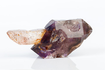 macro mineral stone Amethyst on smoky quartz on a white background