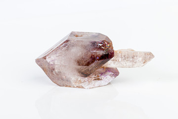 macro mineral stone Amethyst on smoky quartz on a white background