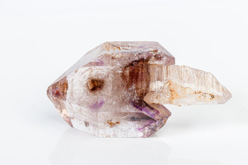 macro mineral stone Amethyst on smoky quartz on a white background