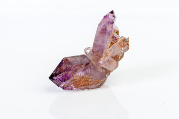 macro mineral stone Amethyst on smoky quartz on a white background