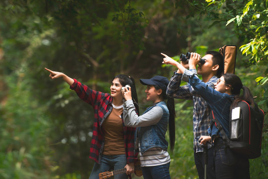  traveler group of friends enjoying views in forest