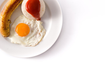Arroz a la cubana.Typical Cuban rice with fried banana and fried egg on a plate isolated on white background. Copy space