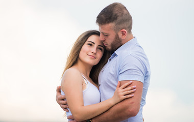 Couple in love. Cute relationship. Man and woman cuddle nature background. Supporting her. Together...