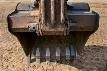 Big bucket of a construction excavator closeup.