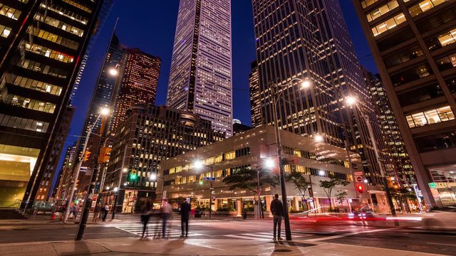 Busy street in Toronto business & financial district day to night time lapse