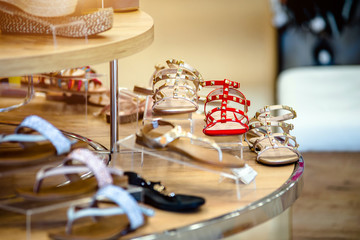 Women's sandals are on the shelf in the store 