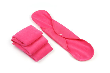 Reusable sanitary napkin pads on white background