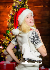 sporty girl. xmas holiday gift. Best present ever. happy woman love figure skating. winter season activity. Christmas time. ready for celebrate new year. cheerful girl red santa hat with skates