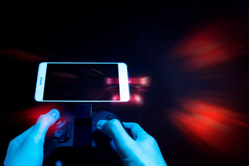 gamer boy with hand holding the joystick controller electronic for playing game with online network connection  technology device in smartphone application © issaronow