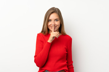 Young blonde woman with red sweater over isolated white background doing silence gesture