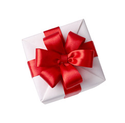Beautiful white gift box with red bow. Happy Women's Day or Christmas and New Year's Day. Top view.