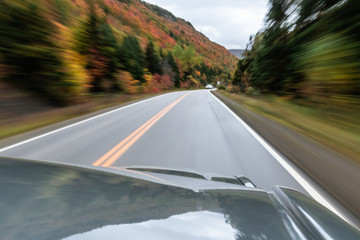 Winding road in the fall with motion blur