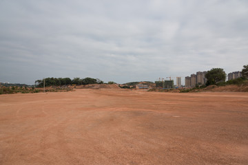 Fototapeta na wymiar City suburban construction site dirt road horizon panorama