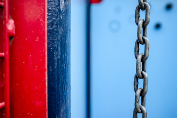 Forged chain from a swing, in the playground, on a bright.