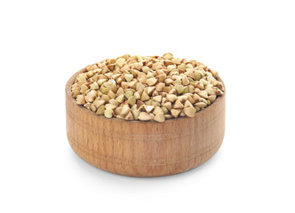 Uncooked green buckwheat grains in bowl isolated on white