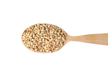 Uncooked green buckwheat grains in spoon isolated on white, top view