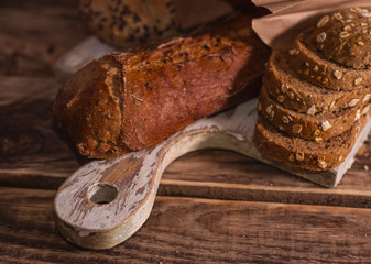 Various homemade bread on rural wooden background