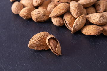 almonds isolated on stone background