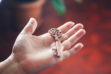 woman hand vintage key