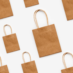 Photo seamless pattern with craft paper shopping bags. Zero waste lifestyle. Copy space.