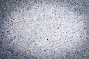 textura de pared gris con piedras de colores incrustadas