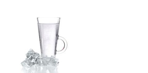 glass of fresh clear water with ice