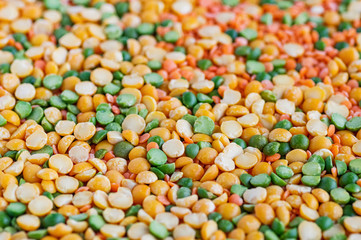 Dried peas and lentils close-up. Background from a mixture of legumes. Selective focus
