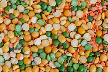Fototapeta na wymiar Dried peas and lentils close-up. Background from a mixture of legumes. Bean diet, vegetarianism.