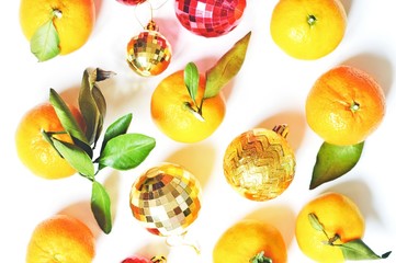 Beautiful photo of decorations and fruits for Chinese New Year celebration. Fresh tangerines and golden and red balls