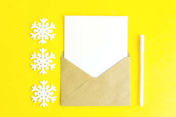 The letter and the snowflake on a yellow background.