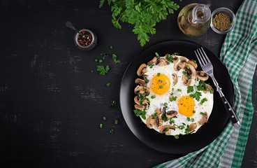 Fried egg, mushrooms and spinach. Keto, paleo breakfast. Top view, copy space