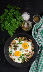 Fried egg, mushrooms and spinach. Keto, paleo breakfast. Top view, copy space