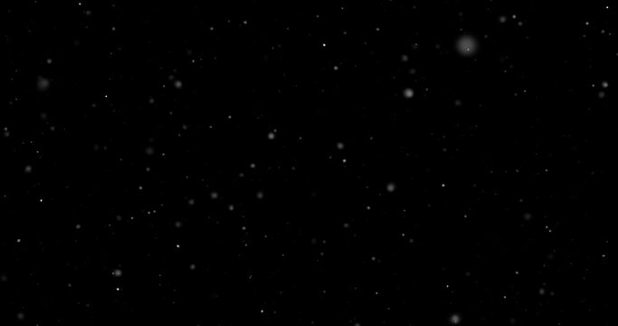 Flying dust particles on a black background