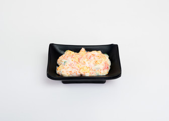 Mayonnaise sauce with salad and ebiko in black cup of japanese food